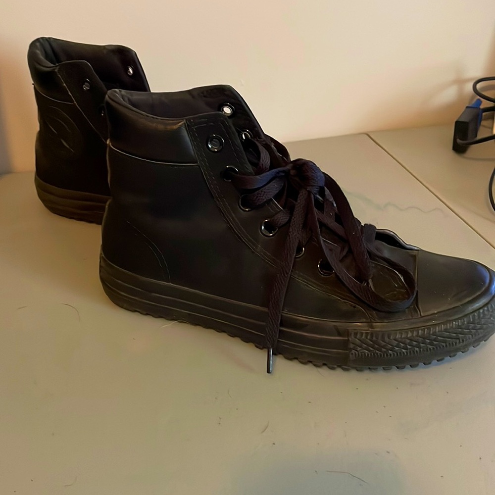 High-top black converse.